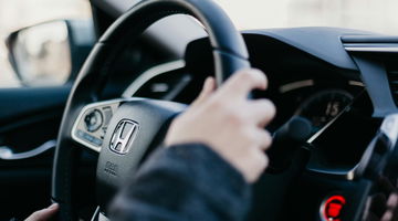 The steering wheel of a Honda car