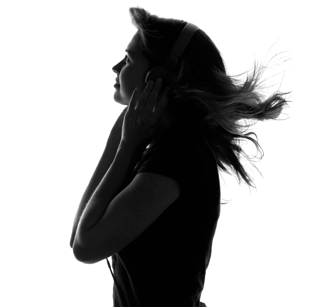 Woman in silhouette listening