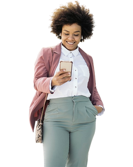 A black woman smiles while looking at her phone