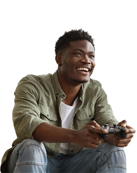 A black man playing video games with a console controller