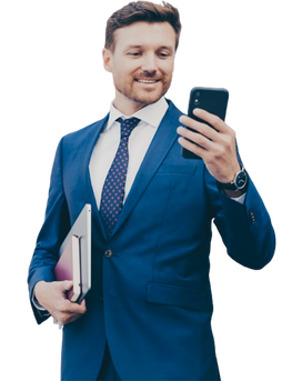 Smiling man in suit looking at smartphone