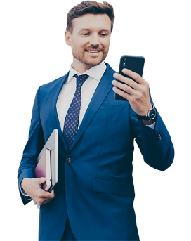 Smiling man in suit looking at smartphone