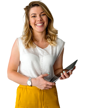 A business woman smiles while holding a tablet in her hands