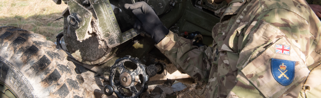 A soldier in front of technological equipment