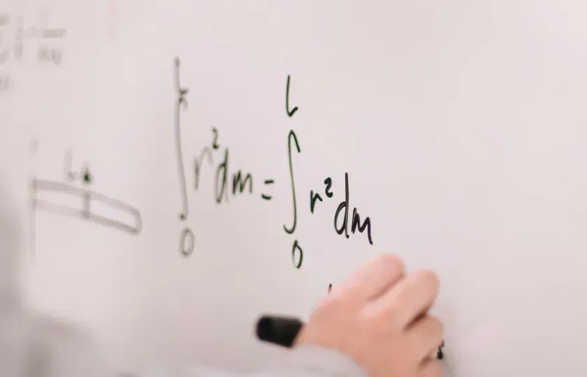 Make STEM accessible with LaTeX and ReadSpeaker - Person writing on white board.