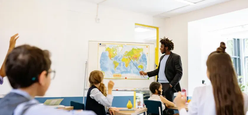 Teacher and studentn in the classroom. Assistive technology for education: how to choose the right tools for your learners