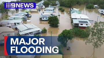 A news graphic showing a massive flood in a typical Australian town.