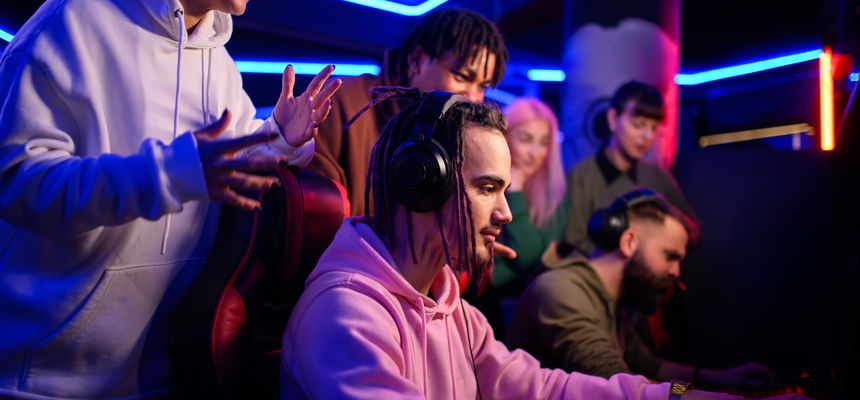 Pro eSports gamer diverse team playing online strategy video game.