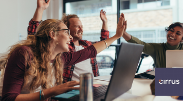 Happy colleagues high-five each other.