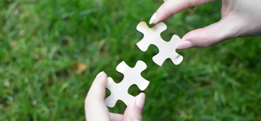 Advancing learner agency through partnership: CAST and ReadSpeaker - female hands holding 2 pieces of the puzzle