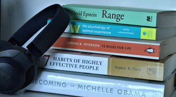 A stack of four books.