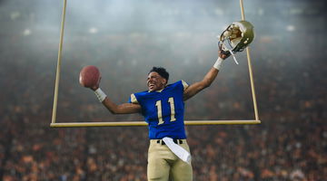 Teenage American football player celebrating victory in stadium.