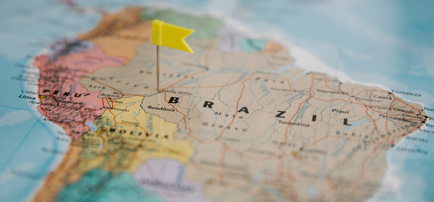 Map of South America with a yellow flag pinned to Brazil.