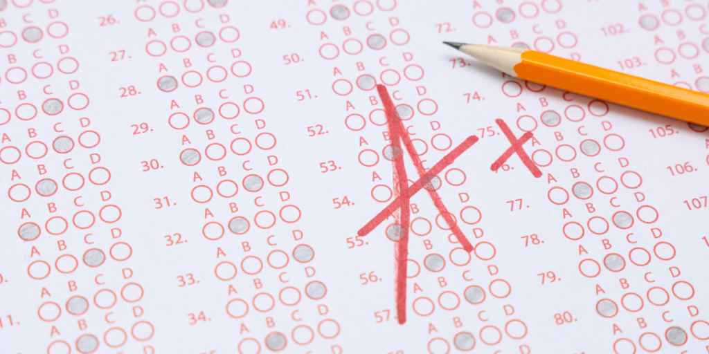 A multiple-choice exam answer sheet, with a large A+ hand-written in red ink on the front.